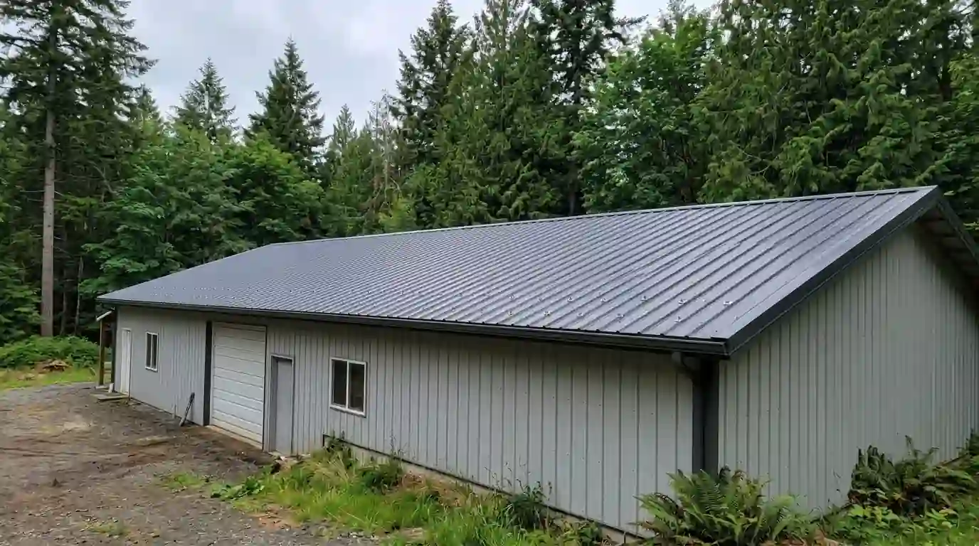 Ribbed metal panels on a pole barn shop roof